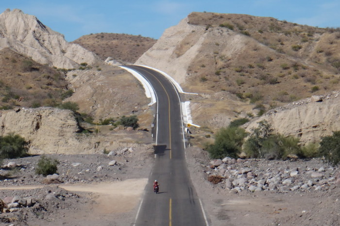 Baja California - Jo cycling the "slope of hell" to the coast near Santa Rosalia!