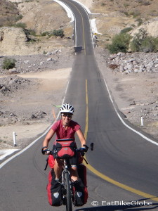 Jo cycling the awesome "slope of hell" to the coast near Santa Rosalia!
