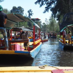 Cruising along the canal with the locals at Xochimilco