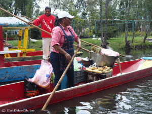You can buy all kinds of food and drinks while floating along the canals! This canoe was selling freshly roasted sweetcorn smile emoticon — in Xochimilco