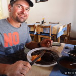 David trying black mole chicken at Restaurante Doña Chica, Mitla