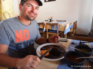 David trying black mole chicken at Restaurante Doña Chica, Mitla