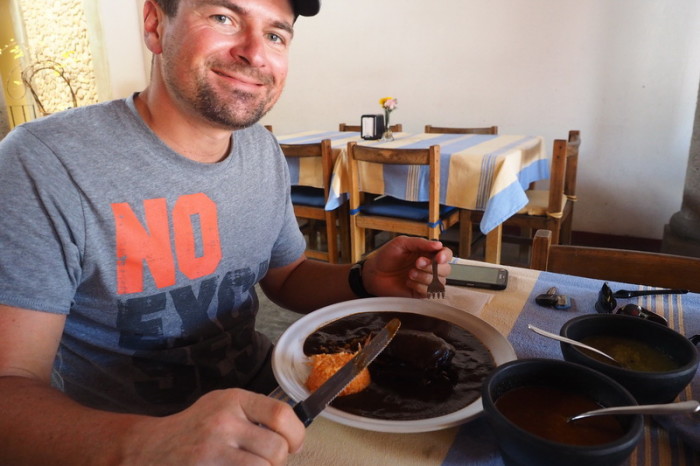 Oaxaca - David trying some chicken with black mole sauce!