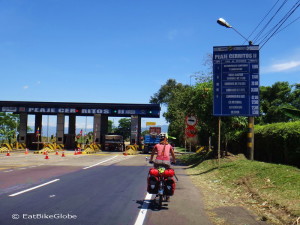 Jo cycling towards one of the many toll booths - bikes pass for free
