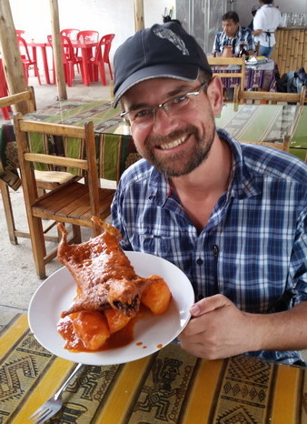 Peru - David trying guinea pig (cuy) at a restaurant near Caraz