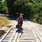 Jo crossing a wooden bridge near Balsas