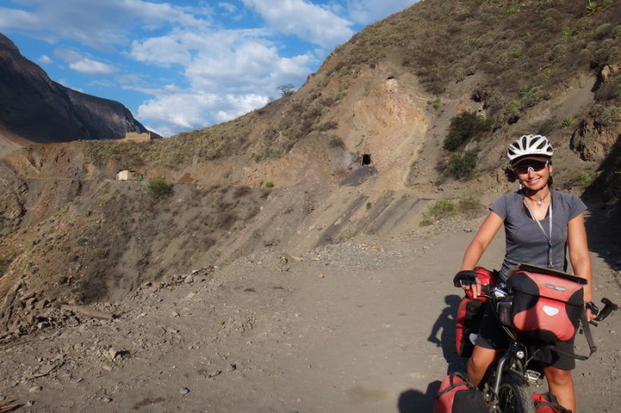 Peru  - Jo cycling the dirt road beside the River Tablachaca