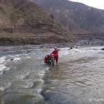 David taking Jo's bike across the river - the current was strong and the water came up to our thighs at times!