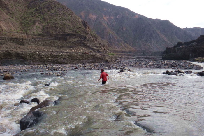 Peru  - David crossing the river to get the last of our panniers