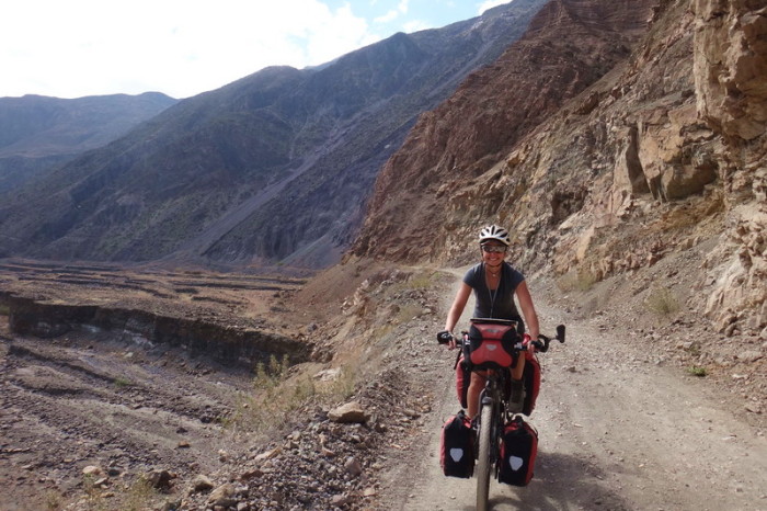 Peru  - Jo cycling the dirt road beside the River Tablachaca