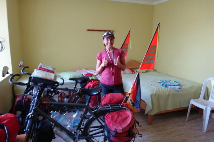 Peru  - This was a pretty shabby room, which smelled of rotten eggs. I'm only smiling because we managed to wheel our bikes into the room fully loaded!