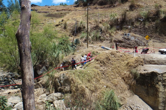 Peru  - Thankfully there was a little path that pedestrians were using to get over the river which the bridge was down and with the help of some friendly locals, we managed to get our bikes safely to the other side! 
