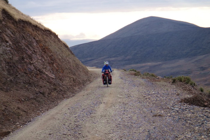 Peru  - Jo cycling the dirt road to Tamboras