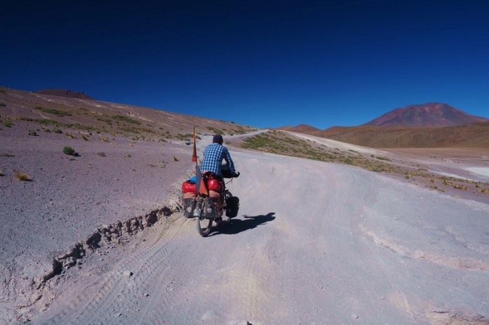 Bolivia - Day 3 of the Laguna Route: David cycling alongside Laguna Honda